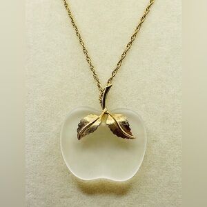 Vintage Avon frosted glass apple pendant on a long gold tone chain. 27 inches